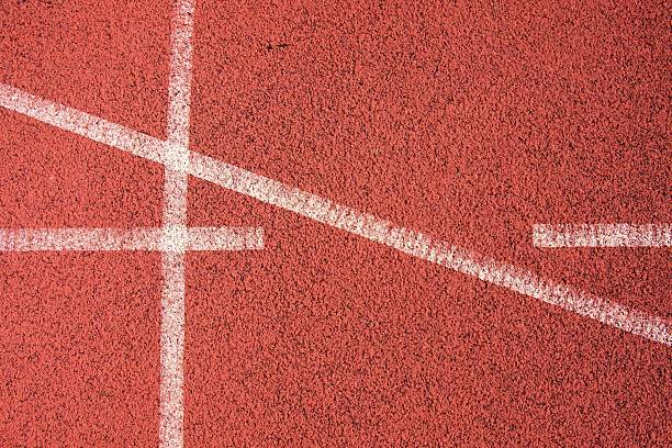 istock White lines and texture of running  red rubber racetracks 468043838