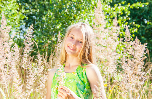  Portrait of happy girl in summer forest