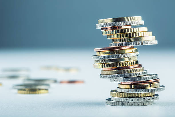 Euro coins. Euro money. Euro currency. Euro coins. Euro money. Euro currency.Coins stacked on each other in different positions. british currency stock pictures, royalty-free photos & images