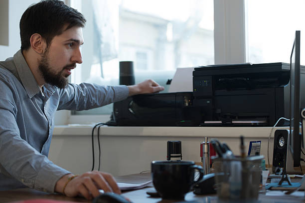 Bearded businessman multitasking at the office