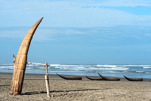 Traditional Peruvian small Reed Boats (Caballitos de Totora), straw boats still used by local fishermens in Peru