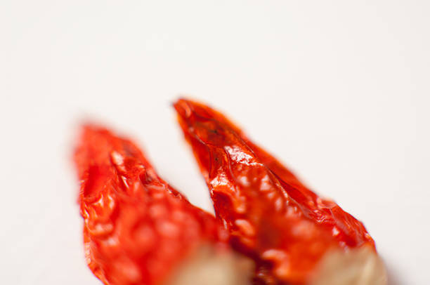 istock Dried hot red chili or chilli pepper on paper background 468046394