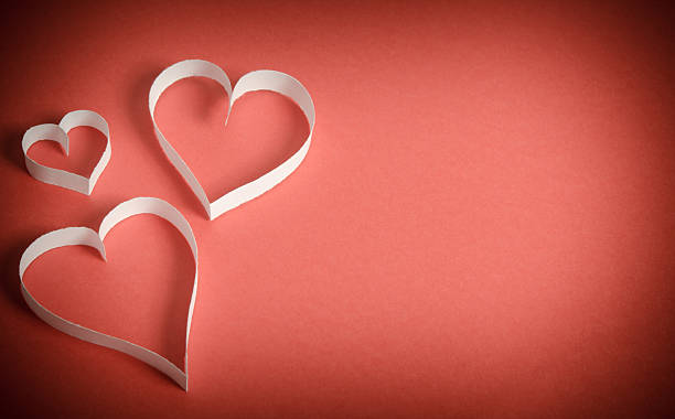 istock Three hearts of white paper on a red background 468046732