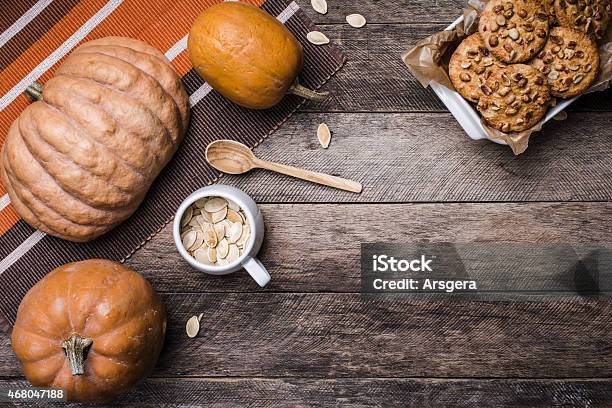 Pumpkins And Cookies With Nuts In Rustic Style Stock Photo - Download Image Now - 2015, Autumn, Backgrounds