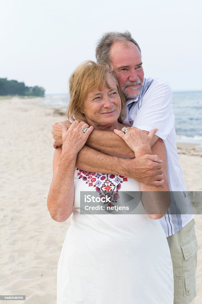 Senior couple Senior couple hugging at the beach 2015 Stock Photo