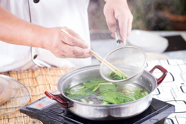 istock Chef scald vegetable in pot before cooking noodle 468048154