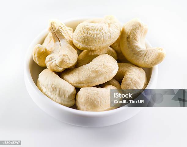 Cashew Heap Of Nuts Isolated On White Background Selective Focus Stock Photo - Download Image Now