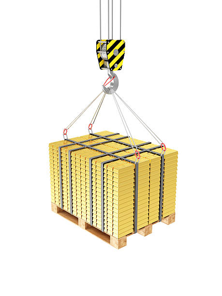 istock Crane Hook with Stacked Golden Bars on a Wooden Pallet 468048308