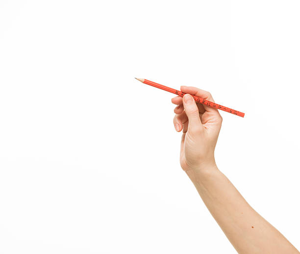 istock Female hand holding a pencil 468048358