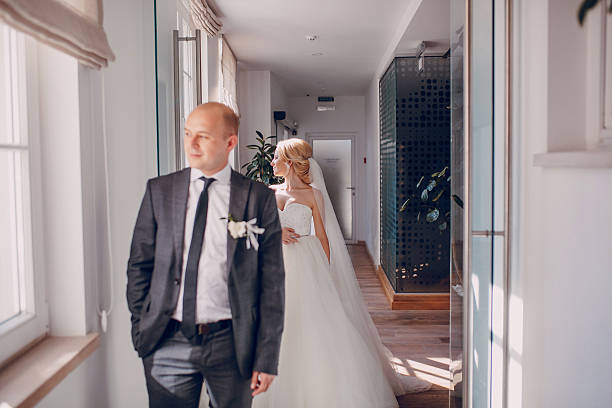 istock blonde bride with her groom 468050564