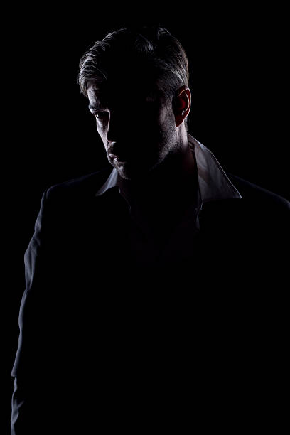 istock Man's silhouette in the dark 468050576