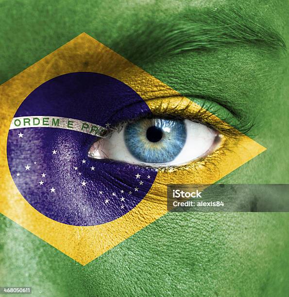 Cara Humana Pintado Con La Bandera De Brasil Foto de stock y más banco de imágenes de Bandera - Bandera, Brasil, Cara humana