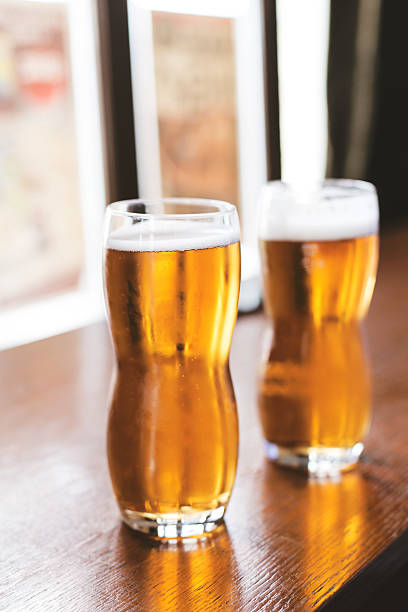 istock Two cups of beer in a pub 468050626