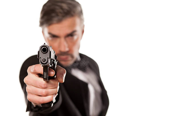 istock man in a suit and a gun 468050818