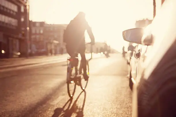 Photo of City commuters. High key blurred image of a street