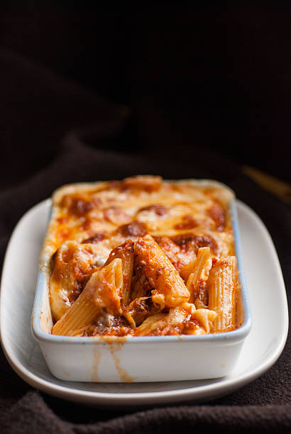 istock Baked penne pasta with tomato sauce and cheese 468051160