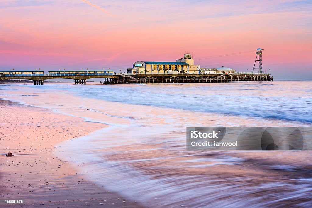 Bournemouth pier sunset Bournemouth pier at Sunset from beach Dorset England UK Europe Bournemouth - England Stock Photo