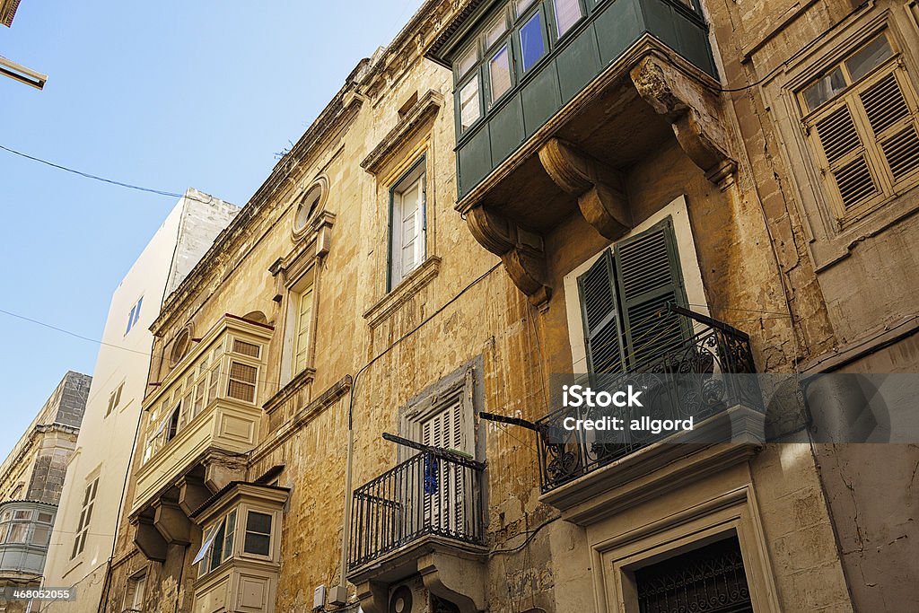 Traditional enclosed balconies in Malta Malta. Old city view. Stylish door. window. Old style. Film style. Ancient Stock Photo