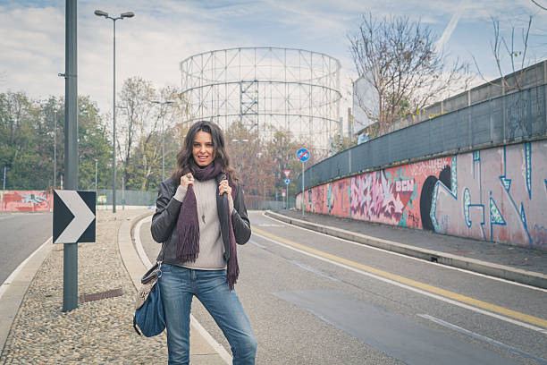 istock Beautiful young brunette posing in the city streets 468052754