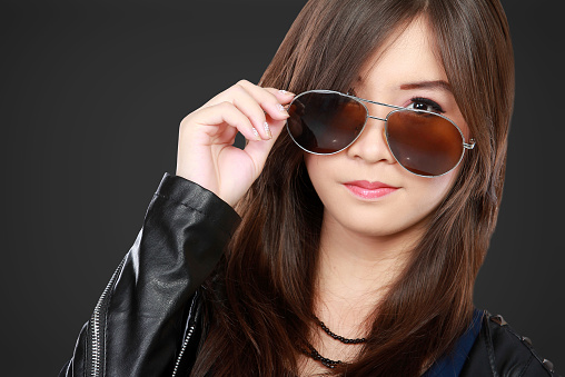 woman in black leather jacket and sunglasses