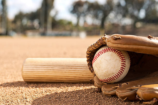 istock Baseball bat, glove and ball on field 468055069