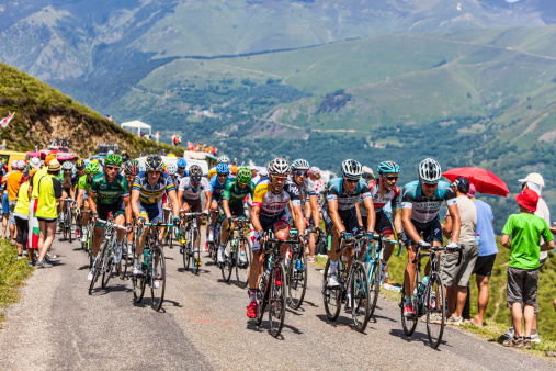 Col de Val Louron-Azet, France- July 07,2013: The peloton passing the Col de Val Lauron-Azet in Pyrenees Mountains during the stage 9 of the 100 edition of Le Tour de France in 2013.