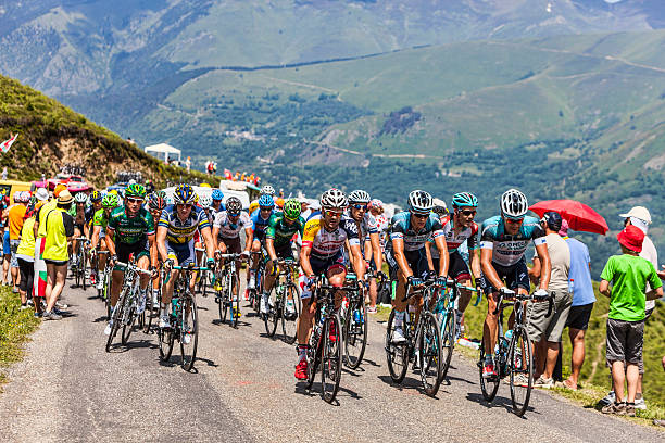 The Peloton in Pyrenees Mountains Col de Val Louron-Azet, France- July 07,2013: The peloton passing the Col de Val Lauron-Azet in Pyrenees Mountains during the stage 9 of the 100 edition of Le Tour de France in 2013. tour de france stock pictures, royalty-free photos & images