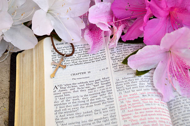 istock Easter Bible background with azaleas and cross. 468058724