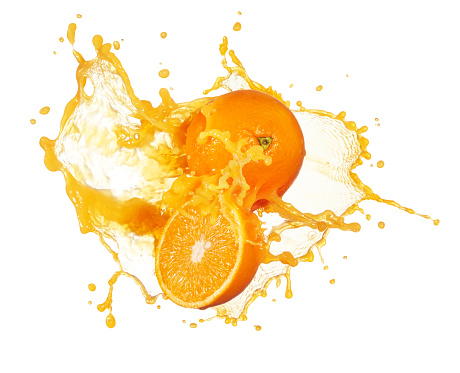 orange juice splashing with its fruits isolated on white