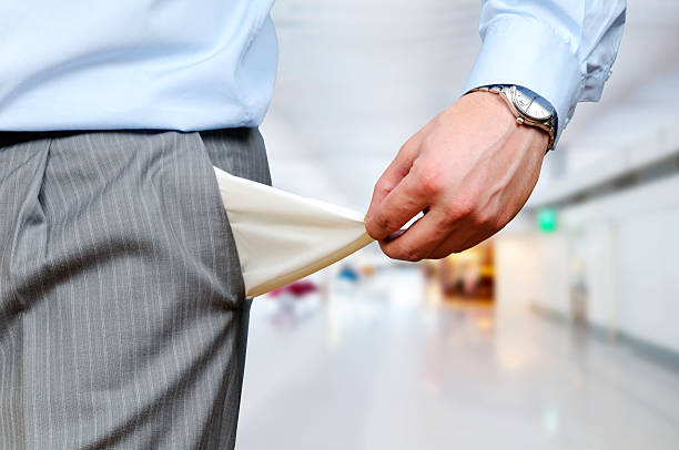 Man pulling out his empty pocket for camera stock photo