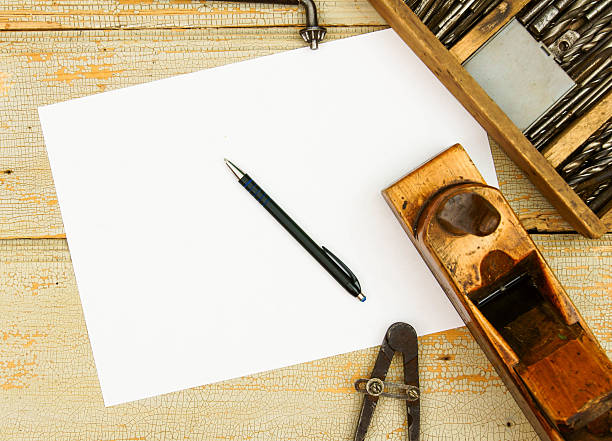 istock Paper with pencil and the vintage working tools on wooden 468059724