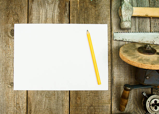 istock Paper with pencil and the vintage working tools on wooden 468059732