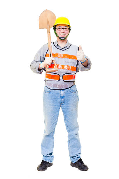 istock Worker holding   shovel  with thumb up isolated on white 468060192