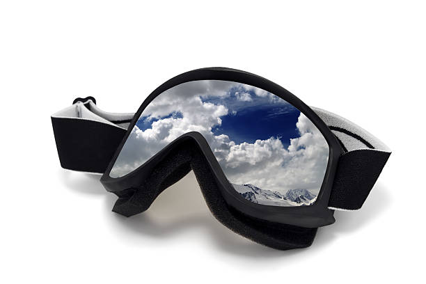 istock Ski goggles with reflection of cloudy mountains 468060500