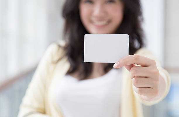 istock Card presented by an Asian woman. 468063492