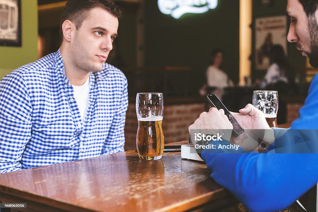 Two friends talking. Serious issues. 2015 Stock Photo