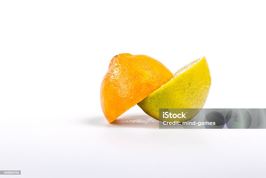 two half ripe lemon and orange. isolated on white background. 2015 Stock Photo