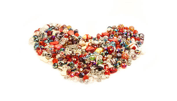 istock heart made from small jewelry isolated on white background 468066611