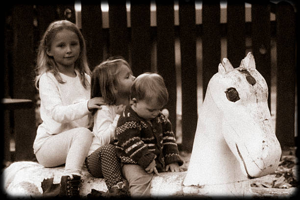 istock 3 kids and a horse 468068474