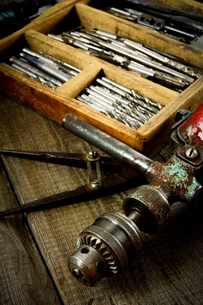 istock Drills in box, drill, chisel on a wooden background 468075412