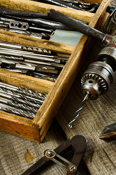 istock Drills in box, drill, chisel on a wooden background 468075446