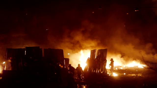 Protesters build barricades during riot