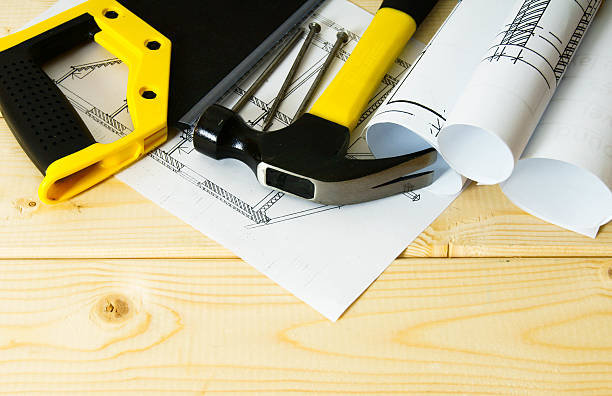 istock Drawings for building and working tools on wooden background 468086182