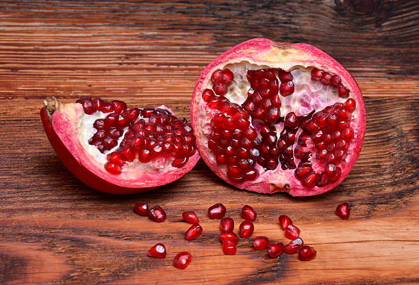 Pomegranates on wood stock photo