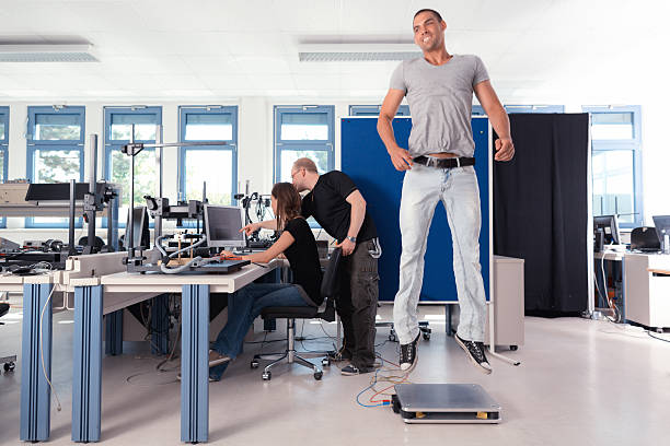 team students working laboratory team of young biomechanics students working on project in lab biomechanics stock pictures, royalty-free photos & images