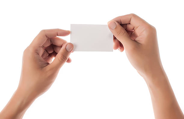 istock Hands hold business cards on white background 468095484