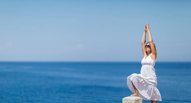 istock Young woman enjoying sea 468095928