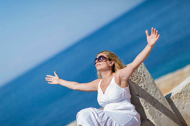 istock Young woman enjoying sea 468095930