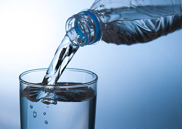 istock pouring water in glass 468099276