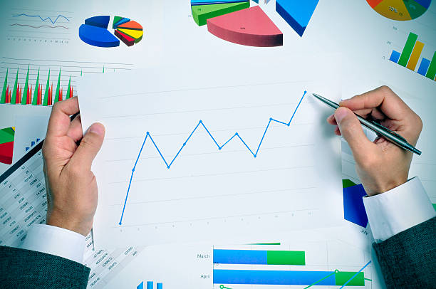 istock businessman observing a chart with an upward trend 468099748